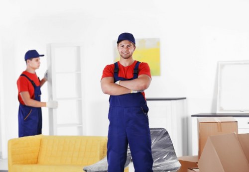Removal team planning a move in Hammersmith with packed boxes and furniture