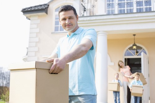 Professional movers handling furniture during a local home removal
